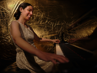 Zoe Rahman energetically playing piano